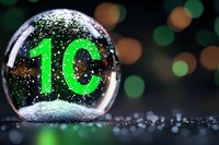 Glowing green number 10 reflected in water drop with bokeh lights background creates magical macro photography effect for celebration or countdown design.