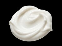 Creamy white cosmetic product swirl isolated on transparent background, ready for skincare packaging, beauty product design, print-on-demand, and sublimation applications.