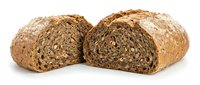 Freshly baked multigrain bread loaf cut in half showing dense seeded texture, artisan bakery product isolated on white background for food design.
