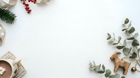 Flat lay composition with evergreen branches, red berries, wooden ornaments, and natural textiles on white background for holiday design projects.