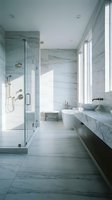 Modern luxury bathroom interior with marble walls, glass shower, freestanding tub and vessel sink for contemporary home design and renovation projects.