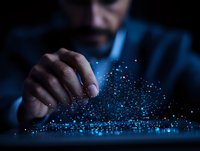Businessman manipulating glowing blue digital particles in dark space, demonstrating future technology and innovation concept for business presentations.