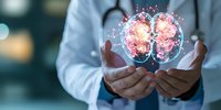 Medical professional holding glowing holographic brain visualization showing neural connections and activity, demonstrating advanced healthcare technology and neuroscience research.