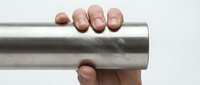 Hand holding shiny metallic cylinder tube on white background for industrial design and engineering applications.