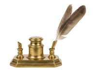 Vintage brass desk set with two quill pen holders and inkwell on rectangular base, isolated on white background for design and product use.