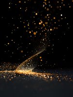 Golden glitter particles scattered on black background creating magical light effect with bokeh and sparkle. Luxury festive atmosphere for design projects.