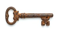 Antique rusty skeleton key isolated on white background, vintage metal object for security, decoration, steampunk design, and historical concepts.