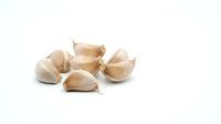 Garlic cloves isolated on white background, ready for culinary design, cooking websites, recipe blogs, food packaging, and restaurant menus.