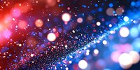 Abstract bokeh background with red and blue light particles creating magical sparkle effect for festive celebrations and holiday decorations.