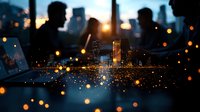 Silhouettes of people against urban skyline at dusk with bokeh light effects in foreground creating magical atmosphere. City lights reflect on water surface.