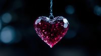 Pink crystal heart pendant catching light against dark bokeh background, romantic jewelry detail macro photography for Valentine's Day and love concepts.