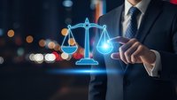 Professional businessman in suit touching glowing digital scales of justice hologram representing legal technology and law firm services at night.