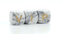VIP golden letters on white marble cubes luxury concept for exclusive membership premium service and high-end business branding on white background.