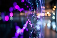 Digital stock market display with glowing purple and orange bokeh lights creating depth and atmosphere. Financial data screen shows market trends.