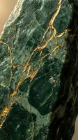 Dark green marble stone with golden veins running through textured surface, isolated on neutral background. Luxury material for design, interior decor, and premium product packaging applications.