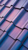 Iridescent roof tiles with purple and blue metallic finish in close-up detail, showcasing textured surface patterns for architectural and construction design projects.