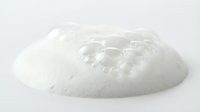Clear transparent gel blob with bubbles isolated on white background for skincare cosmetic product design and beauty applications.