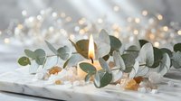 Spa wellness candle with eucalyptus leaves and sea salt crystals on white marble surface with warm bokeh lights creating peaceful relaxation atmosphere.