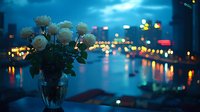 White roses in crystal vase against evening cityscape with blurred lights reflecting on wet streets, creating romantic urban atmosphere.