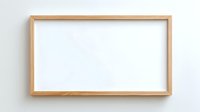 Empty wooden frame with white canvas hanging on wall ready for artwork display and interior decoration projects.