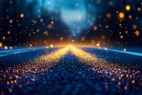 Glowing golden particles and light rays on dark blue textured surface create magical atmosphere with bokeh effect and sparkles for fantasy backgrounds.