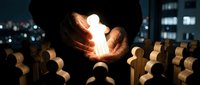 Hands holding glowing lightbulb surrounded by wooden figures in dark setting, representing innovation, leadership, and creative ideas for business solutions.