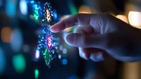 Glowing digital DNA helix hologram with human hand interaction against dark background with bokeh lights, representing genetic research and biotechnology advancement.