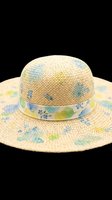 Straw sun hat with floral blue and green watercolor print, isolated on transparent background, ready for T-shirts, stickers, clipart, and print on demand use.