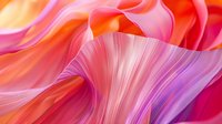 Vibrant flowing waves in coral pink, orange and purple create dynamic abstract background with smooth gradient transitions and silky texture for modern design projects.