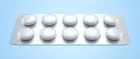 White round pills in silver blister pack on light blue background. Medical pharmaceutical tablets for healthcare and treatment concepts.