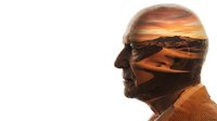 Double exposure silhouette of man with desert landscape at sunset creating artistic conceptual portrait for meditation and mindfulness themes.