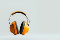 Orange protective headphones on light background with copy space. Professional hearing protection equipment for construction and industrial work.