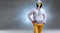 Person wearing white hoodie and yellow pants with question mark symbol instead of face standing against gray background, mystery concept.