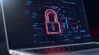 Glowing red padlock icon on laptop screen with digital code elements in dark blue tones, representing cybersecurity and data protection concepts for business use.