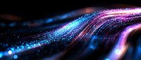 Abstract glowing wave of blue and pink light particles flowing on black background, creating dynamic motion trails and bokeh effect for technology designs.