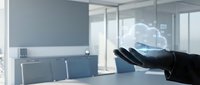 Modern office workspace with businessman hand presenting holographic cloud computing technology for digital transformation and data storage solutions.