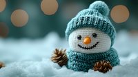 Adorable knitted snowman with teal winter hat and scarf sitting in snow with pine cones, cozy holiday decoration for seasonal crafts and festive designs.