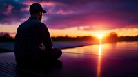 Silhouette of man sitting alone on dock during dramatic purple sunset over lake, reflecting golden sun rays on calm water surface. Peaceful meditation moment.