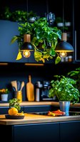 Modern dark kitchen interior with hanging pendant lights and fresh herbs in pots. Wooden countertop features citrus fruits and cooking utensils against black cabinets.