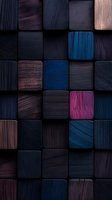 Dark wooden blocks arranged in grid pattern with deep blue, pink and brown accents creating modern geometric abstract background for luxury design projects.