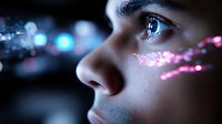Close-up profile of young woman's face with glowing pink and blue bokeh light effects creating magical atmosphere, artistic beauty portrait with glitter makeup.