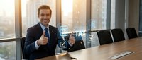 Confident businessman giving thumbs up while reviewing digital tax documents and financial data in modern office conference room during sunny day.