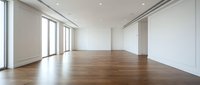 Modern empty apartment interior with hardwood floors, white walls, large windows and natural light for real estate or home design projects.