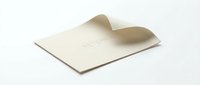 Elegant cream envelope with curved flap on white background, isolated for wedding invitations, correspondence, and stationery design projects.