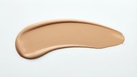 Liquid foundation makeup smear in medium beige tone isolated on white background for cosmetic product advertising and beauty industry design projects.