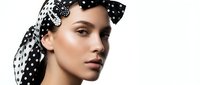 Young woman with fair complexion wearing black and white polka dot headwrap, showcasing elegant styling and beauty makeup for fashion and portrait photography.