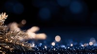 Festive evergreen branch with golden bokeh lights creating magical holiday atmosphere for seasonal celebrations and winter decorations.