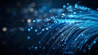 Glowing blue fiber optic cables with bokeh light effects on dark background create futuristic technology concept for digital communication and internet.