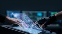 Human and robotic hands collaborating on futuristic holographic interface displaying digital data and circuit patterns for technology innovation concepts.