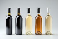 Five wine bottles in a row showing different wine varieties from red to white, arranged on white background for wine menu, restaurant, or store promotion.